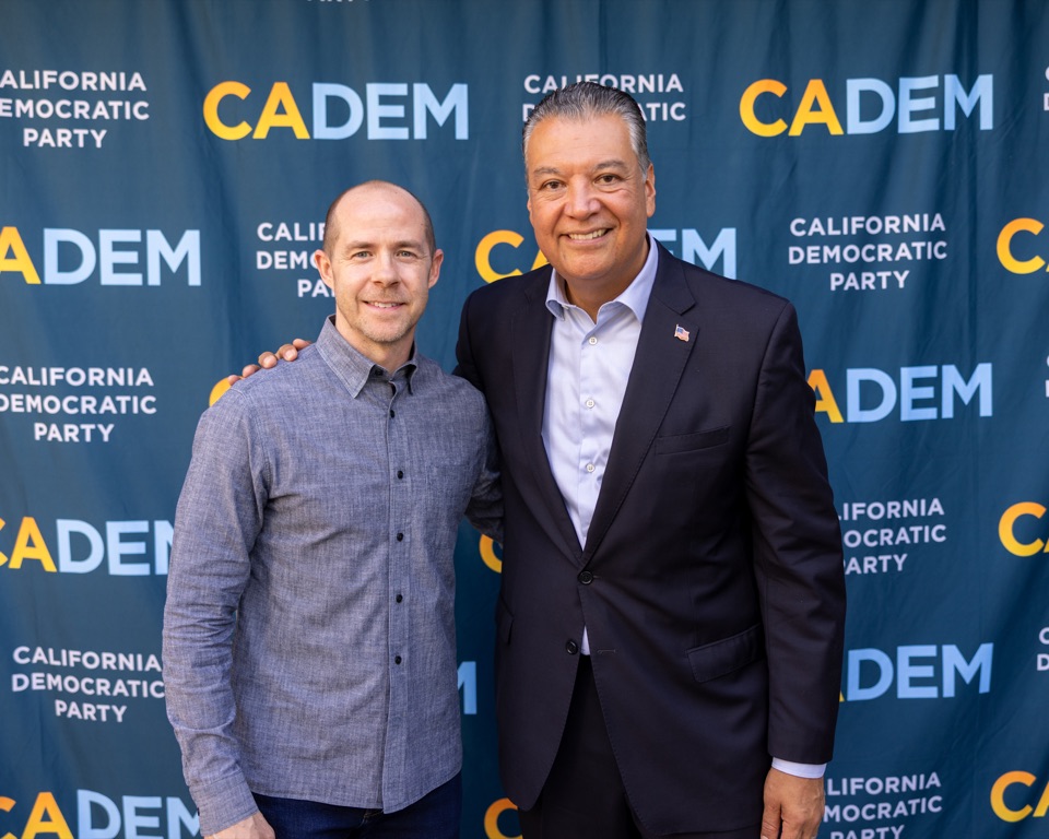 CADEM Chair Rusty Hicks, left, and U.S. Senator Alex Padilla posing together at a California Democratic Party brunch reception